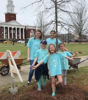 Kids planting trees for Arbor Day Columbus TREES celebration